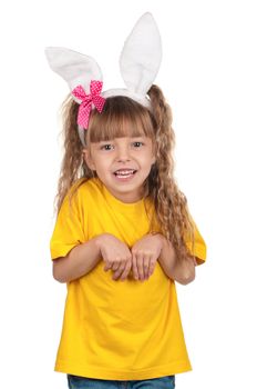 Portrait of happy little girl with bunny ears over white background.