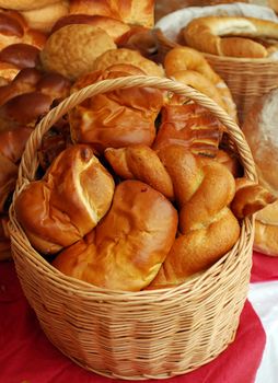 Wooden basket with bread and croissant