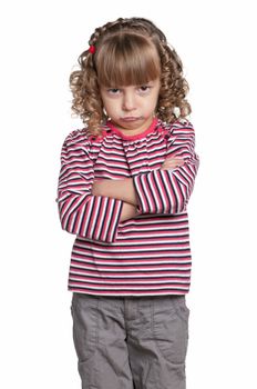 Portrait of emotionally pretty little girl on white background