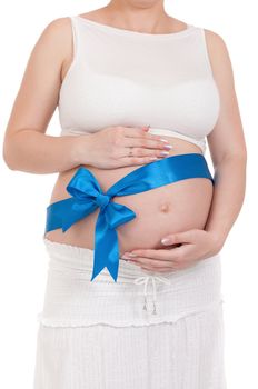 Pregnant belly with blue ribbon - isolated over a white background. Third trimester.