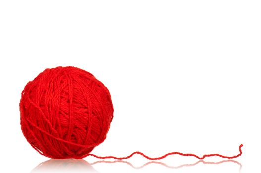 Red ball of yarn for knitting isolated on white background