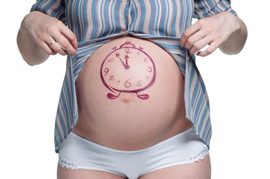 Tummy of pregnant woman with funny drawing over white background