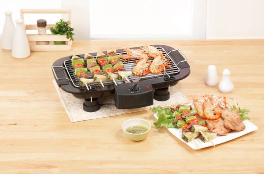 Electric appliance barbecue grill in the kitchen