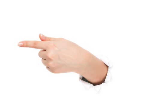 Woman hand making sign through a hole in paper isolated on white background