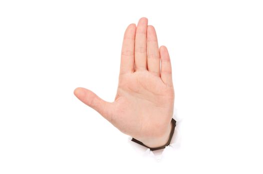 Woman hand making sign through a hole in paper isolated on white background