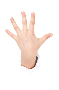 Woman hand making sign through a hole in paper isolated on white background