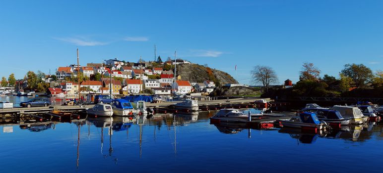 Marina. Rocky island with houses in Kragero, Norway