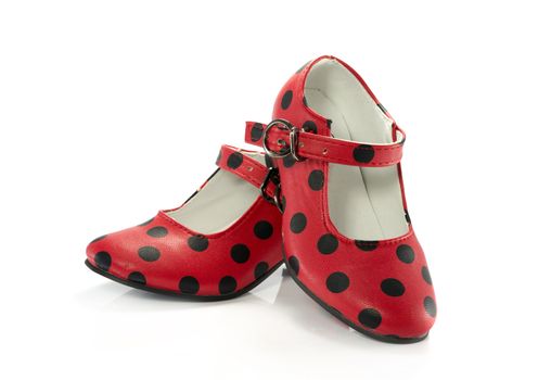 red shoes with black dots isolated on white