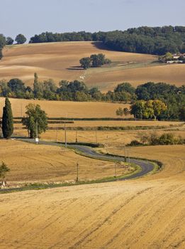 Road winding through the autumn landscape in SWFrance