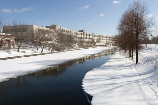 semi frozen river in winter city Minsk, Belarus