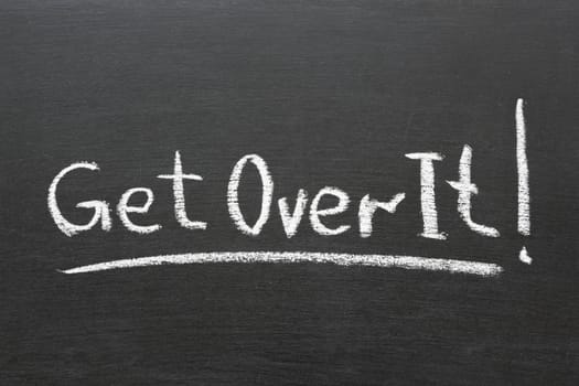 get over it phrase handwritten on school blackboard