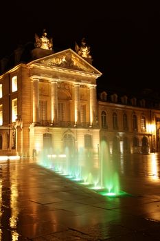 dijon government building at night after rain 