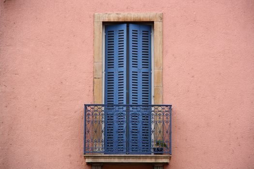 pink wall and blue balcony from old times 