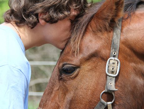 horse love - teen boy with his horse 