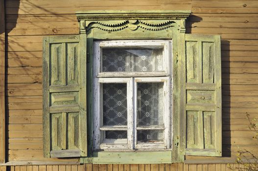 old style window with open wooden shutters