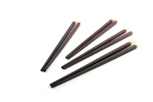 Thai wooden chopsticks on white background