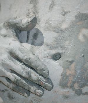 Young pregnant woman getting mud skin treatment