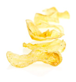 Handmade potato chips on white background