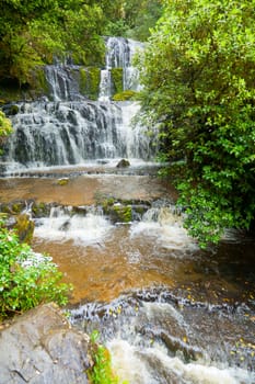Cascading waterfall on the Purakaunui River in the South Island of New Zealand