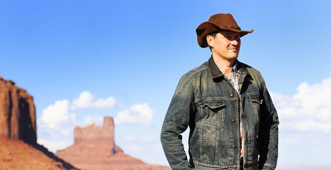 attractive cow boy in famous Monument valley National tribal park, USA