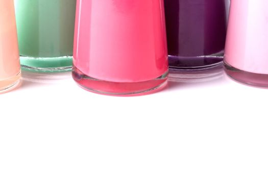 Group of bright nail polishes on white background