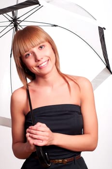 Young fashionable woman smile and holding umbrella