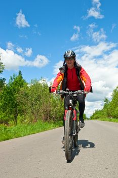 Traveling cyclists on country road