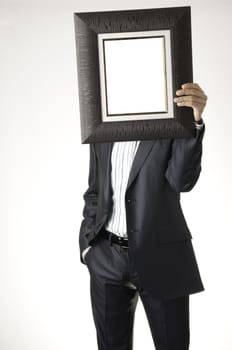 Businessman holding frame