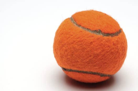 Orange color tennis ball