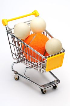 Shopping cart, pingpong ball and tennis ball