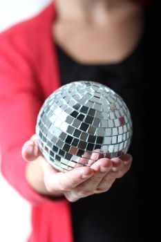 girl with a mirror ball in her hand