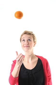 woman juggling with an orange