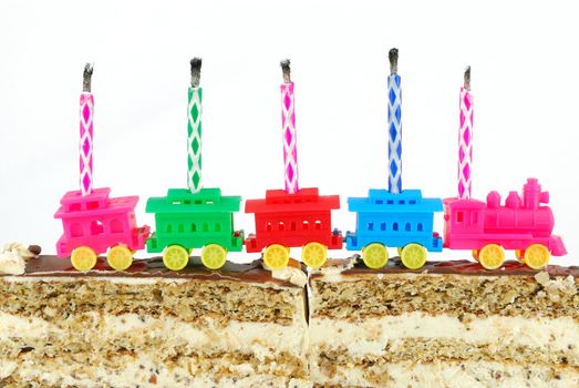 Birthday cake with candles on white