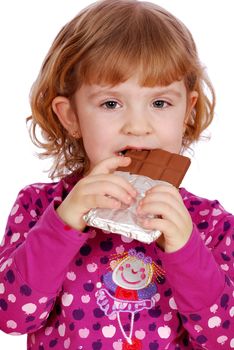 Little girl eating chocolate studio shot