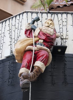 santa clows swinging at rope
