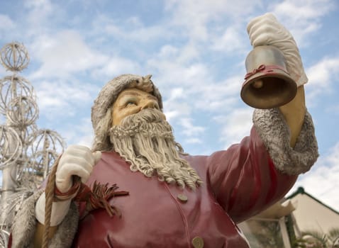 santa claus ringing the golden bell