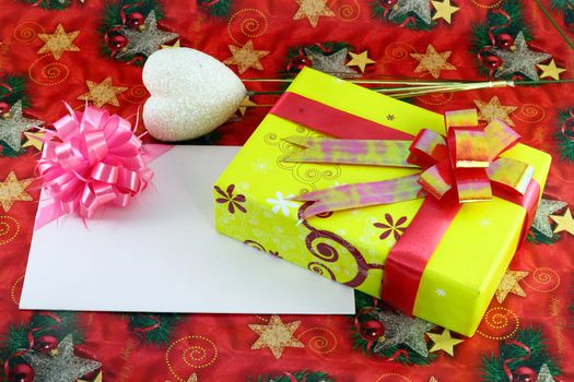 Gift box and gift card on cristmas paper background
