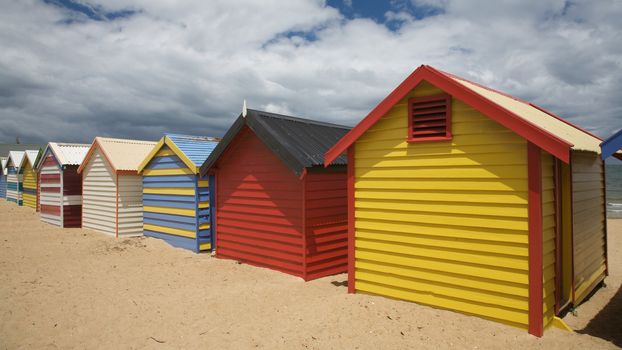 Colorful beach huts at a beach in Melbourne, Australia