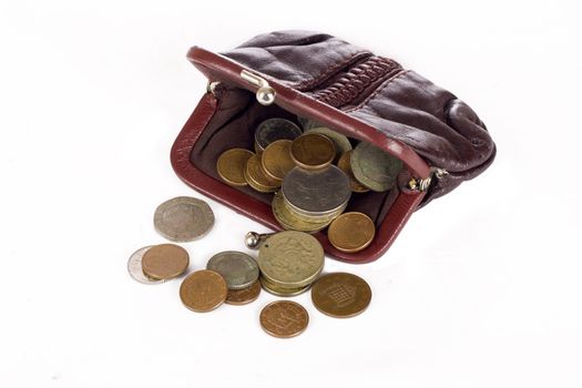 Purse with different coins isolated on white background
