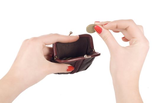 Female hands holding coin and purse isolated on white
