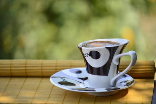 cup of coffee in white and brown on a table