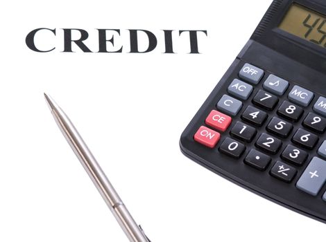 Silver pen, calculator and agreement on a white background