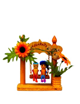 decoration gift with lovely boy and girl sit on swing