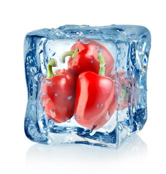 Ice cube and red peppers isolated on a white background