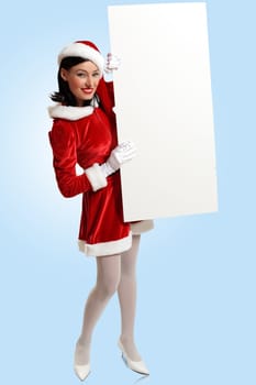 Portrait of a santa girl with a blank banner