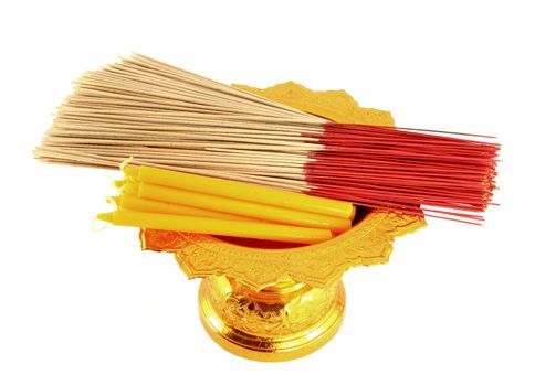 candle and incense on golden tray on white background