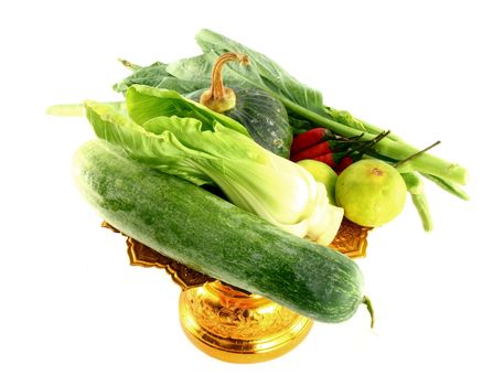 Vegetables mix on golden tray on white background