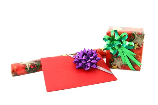 Gift box and roll paper with gift card on white background