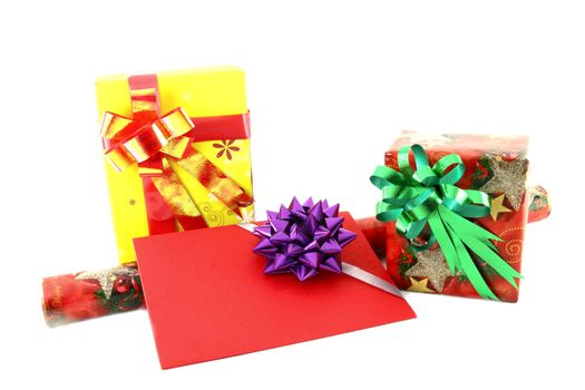 Gift box and roll paper with gift card on white background