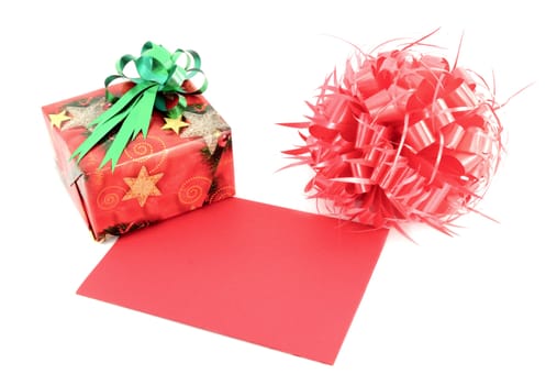 Red gift box and gift card and ribbon bow on white background